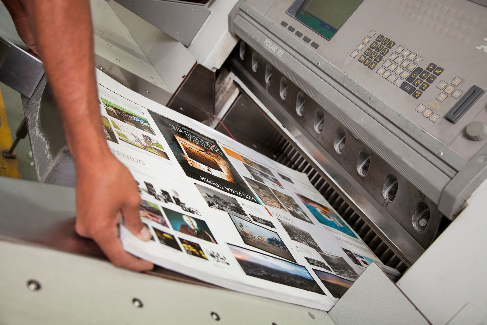 A freshly printed piece coming off the press at The R Frank Printing Company